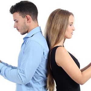 man and women being hypnotised by their phones.