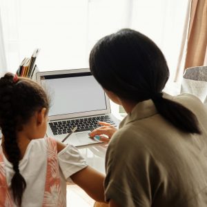 Mother helping child with psychological aid