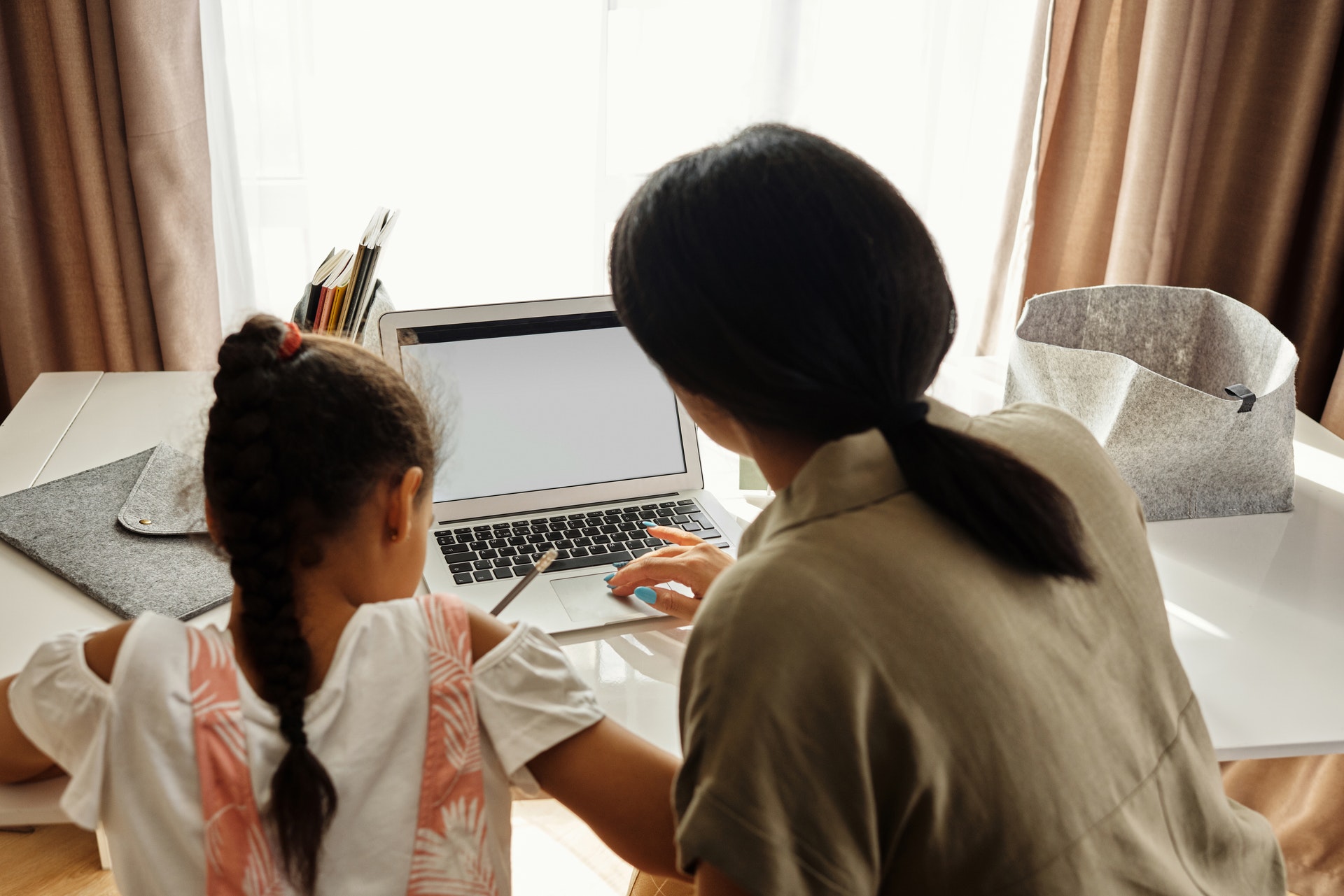 Mother helping child with psychological aid