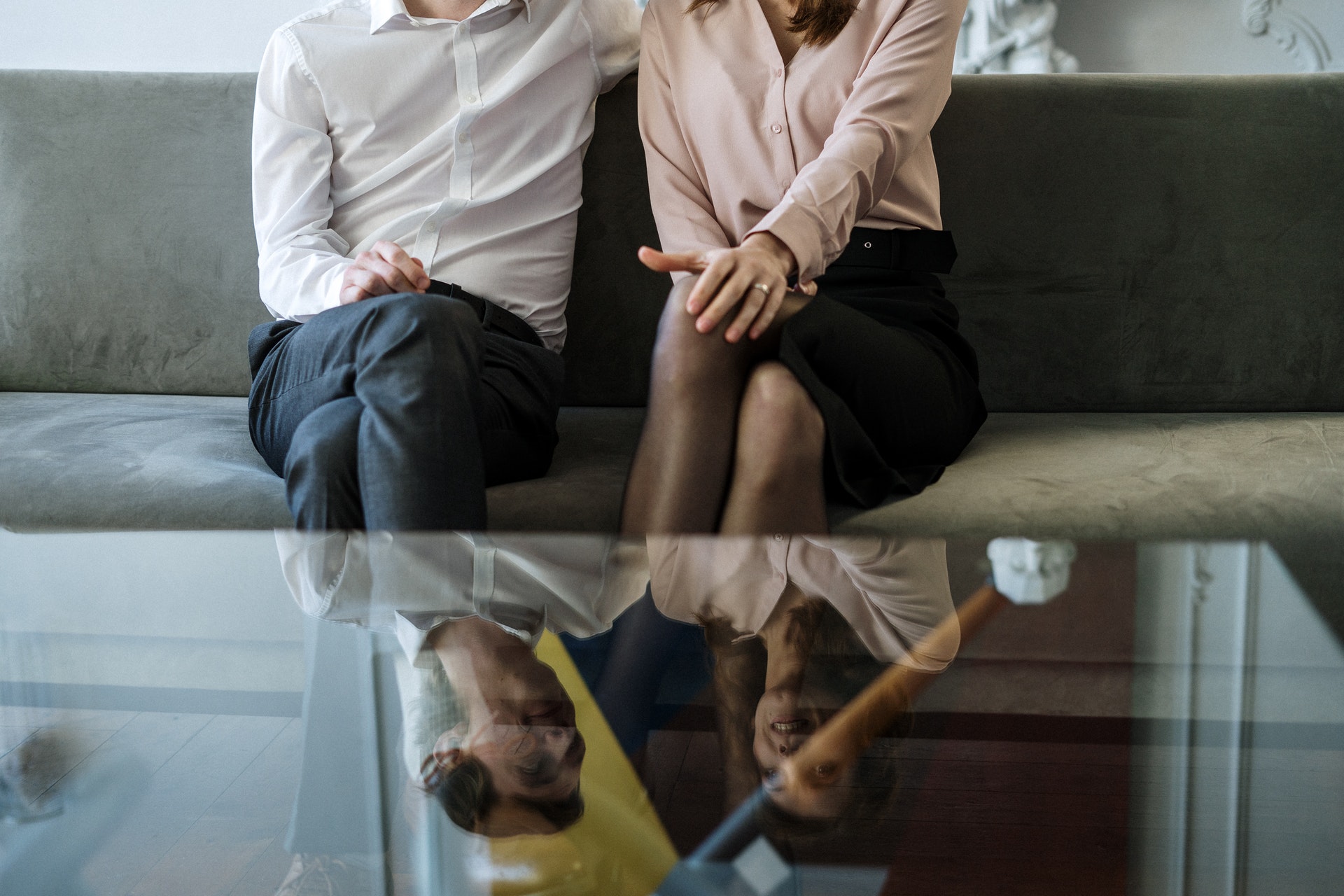 couple sitting on a couch in couples counselling session