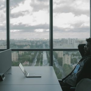 man at his computer suffering with anxiety