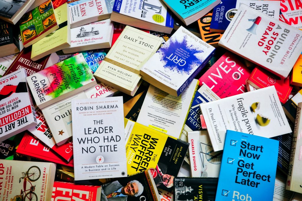 a pile of self help psychology books