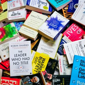 a pile of self help psychology books