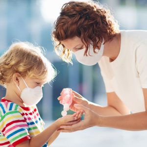 Mother and child wear facemask during coronavirus