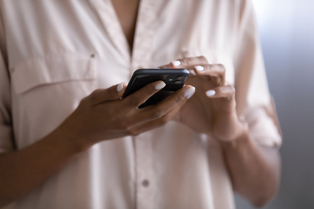 woman texting on her phone